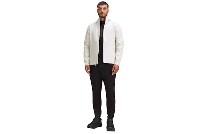 A man wearing a lululemon cross chill jacket in white